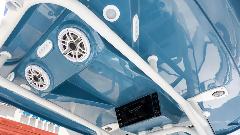 Slide: The Image of View of a boat's blue roof with speakers and lights. - 6
