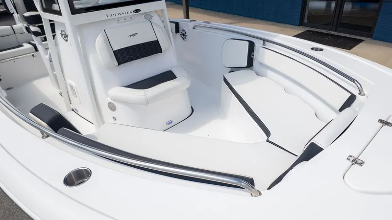 Slide: The Image of The image shows the bow area of a Tidewater 210 LXF boat with white upholstery. - 12
