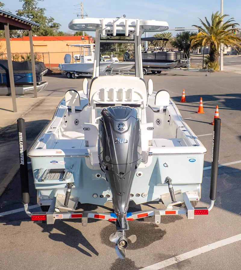 Slide: The Image of The image shows a 2026 Tidewater 2210 Carolina Bay boat with a powerful outboard motor. - 4