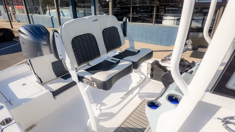 Slide: The Image of The image shows the cockpit of a 2026 Tidewater 2210 Carolina Bay boat with modern seating and controls. - 14