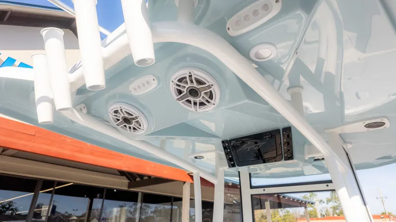 Slide: The Image of The image shows a boat's roof with speakers and lights. - 9