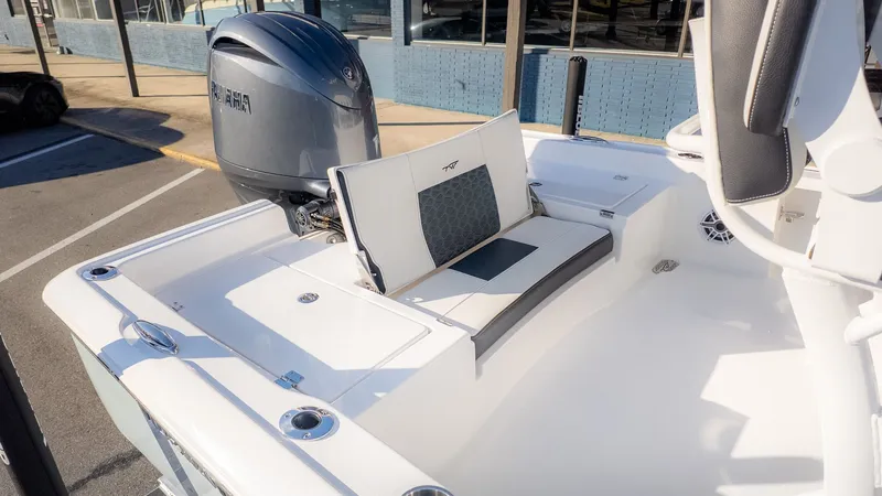 Slide: The Image of The image shows the stern of a Tidewater 2210 Carolina Bay boat with an outboard motor. - 5