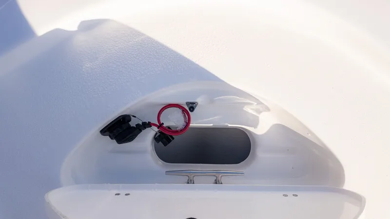 Slide: The Image of Close-up of a boat storage compartment with outlets and a red cable. - 18