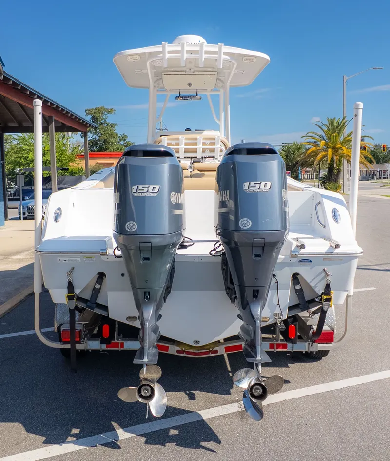 Slide: The Image of The image shows a sport boat with twin Yamaha outboard engines on a trailer. - 4