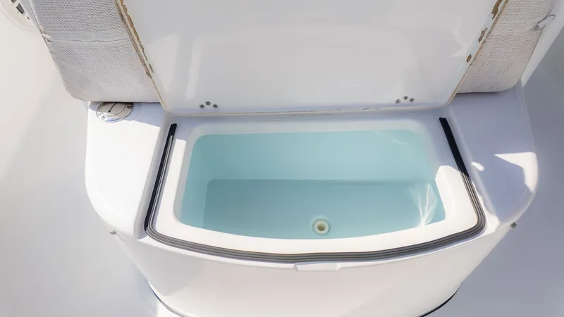 Slide: The Image of An open storage compartment on a 2014 Sportsman 251 Heritage boat. - 19