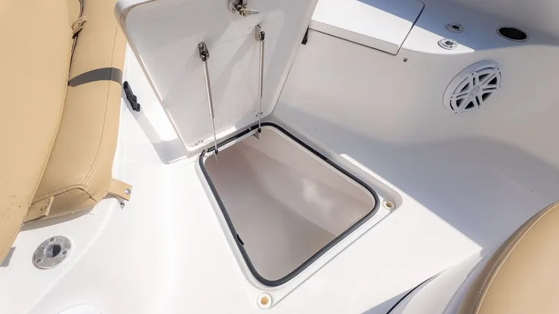Slide: The Image of An open storage compartment on a 2014 Sportsman 251 Heritage boat. - 15