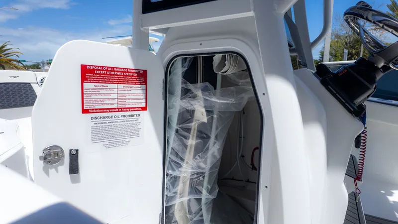 Slide: The Image of The image shows a boat interior with an open door and a red warning sign. - 8