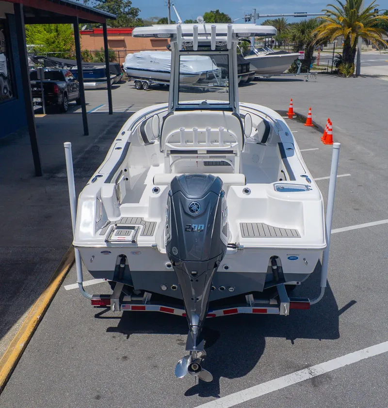 The Image of A 2026 Tidewater 220 CC Adventure boat is parked. It features an outboard motor. - 1
