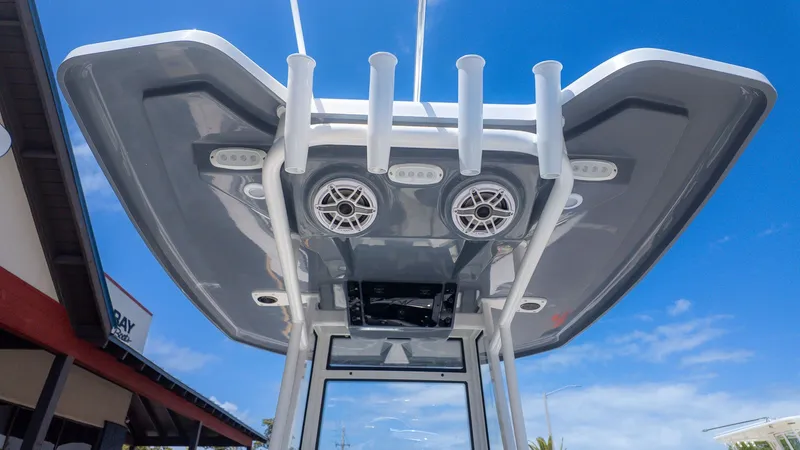 Slide: The Image of The image shows a boat's roof with speakers and fishing rod holders. - 15