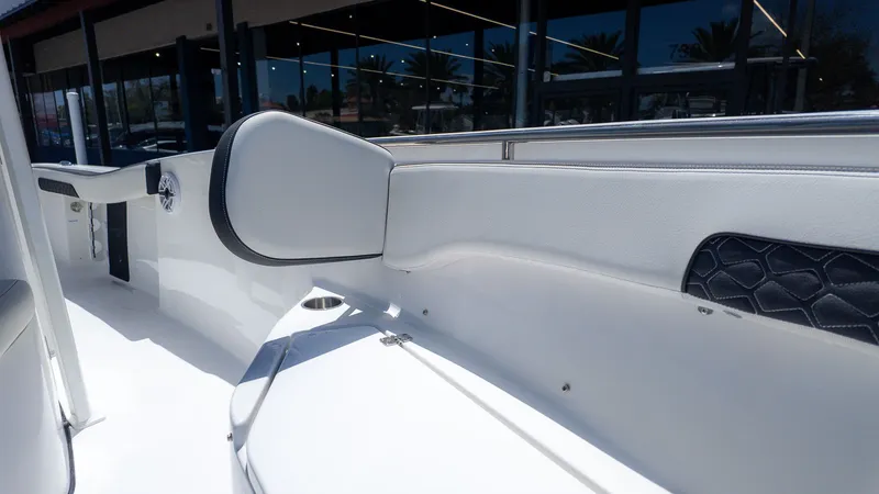 Slide: The Image of Interior view of a modern boat with white upholstery and sleek details. - 10