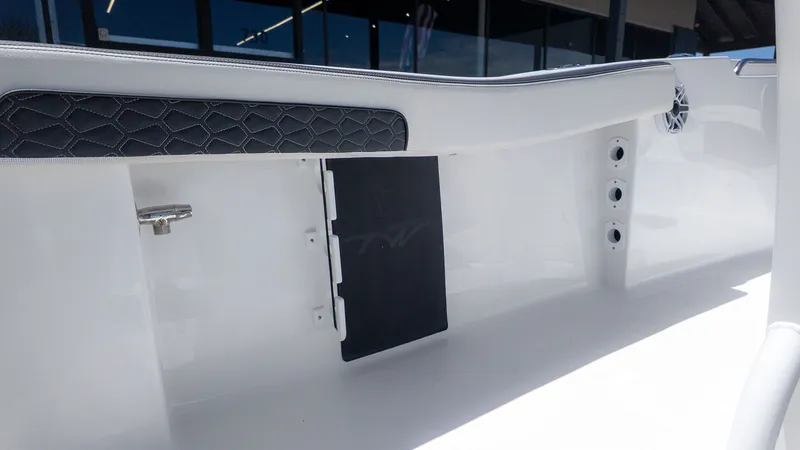 Slide: The Image of Interior view of a Tidewater 220 CC Adventure boat with white surfaces and black accents. - 5