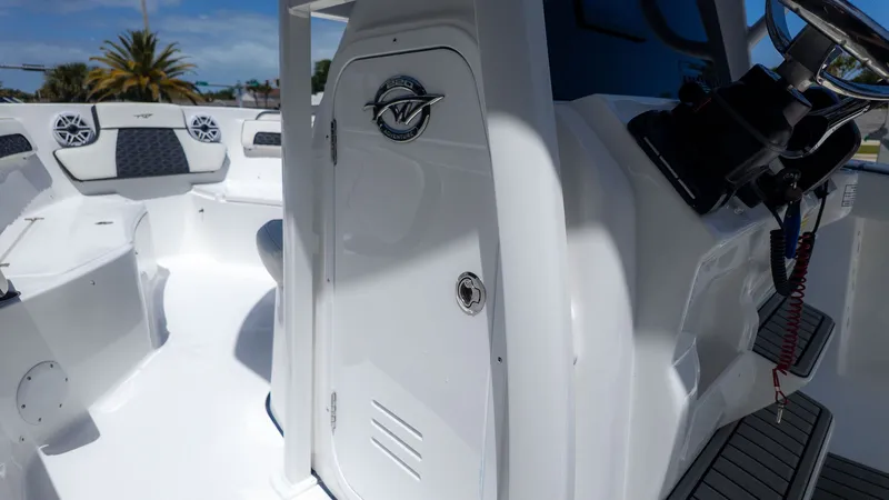 Slide: The Image of The image shows the cockpit of a Tidewater 220 CC Adventure boat with modern controls. - 6