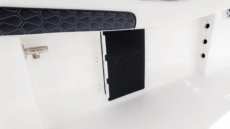 Slide: The Image of Close-up of a white boat with black padding and stainless steel fittings. - 7