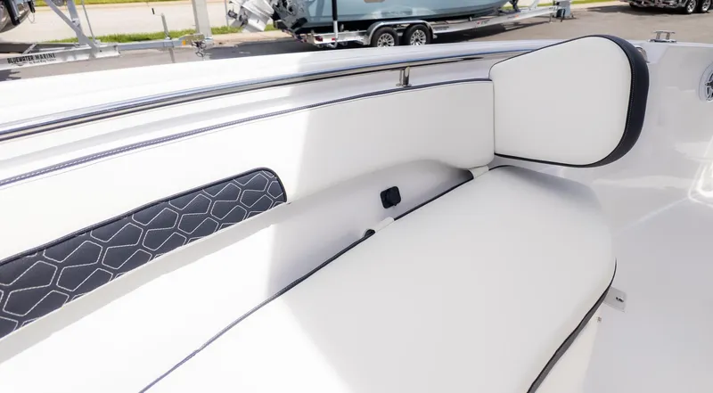 Slide: The Image of The 2026 Tidewater 220 CC Adventure features a sleek, cushioned seating area with modern accents. - 15