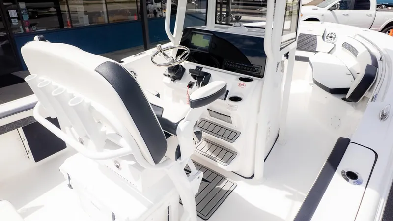 Slide: The Image of The image shows the cockpit of a Tidewater 220 CC Adventure boat with modern controls. - 9