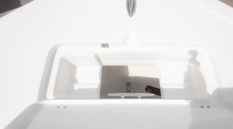 Slide: The Image of The image shows the bow area of a boat with storage and an anchor holder. - 16