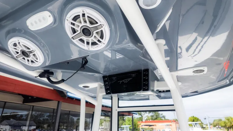 Slide: The Image of The image shows a boat's roof with speakers and a screen. - 7