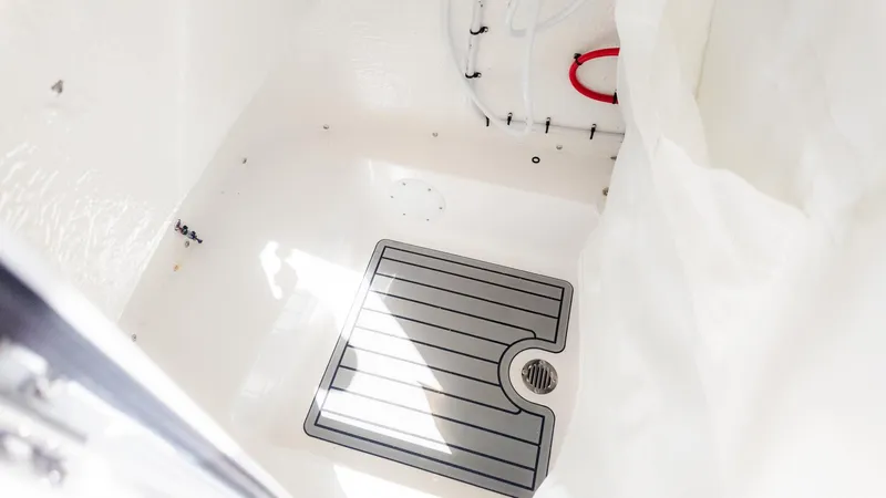 Slide: The Image of Interior view of a boat with non-slip flooring and a drain. - 17