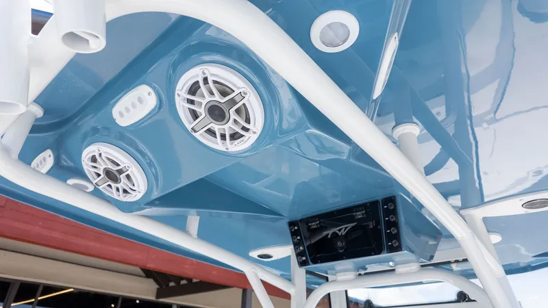 Slide: The Image of View of a boat's blue roof with speakers and a screen. - 11