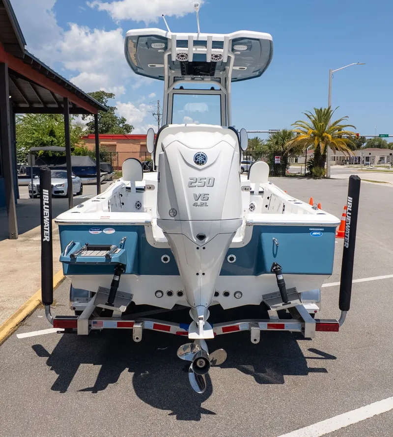 Slide: The Image of A Tidewater 2210 Carolina Bay boat on a trailer, featuring a 250 HP outboard motor. - 4
