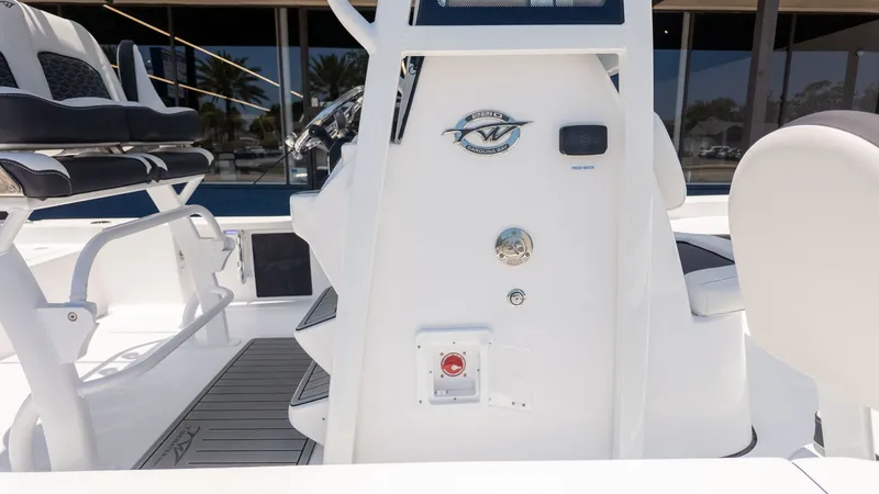 Slide: The Image of The image shows the cockpit of a Tidewater 2210 Carolina Bay boat with modern seating. - 13