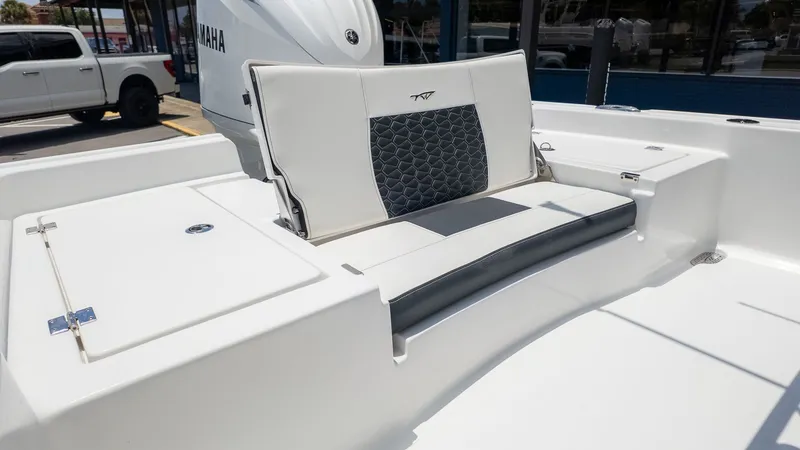 Slide: The Image of The image shows the seating area of a Tidewater 2210 Carolina Bay boat with a Yamaha engine. - 3