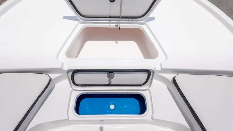 Slide: The Image of The image shows the storage and livewell of a Tidewater 2210 Carolina Bay boat. - 17