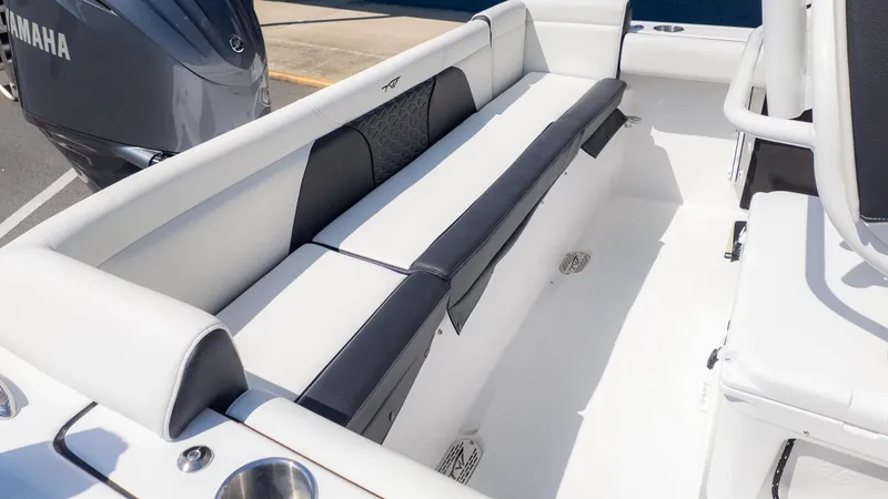 Slide: The Image of The image shows the interior of a Tidewater 232 LXF boat with white and black seating. - 5