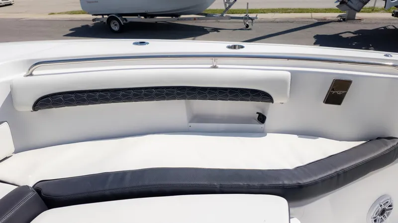 Slide: The Image of The image shows the seating area of a Tidewater 232 LXF boat with cushioned seats. - 15