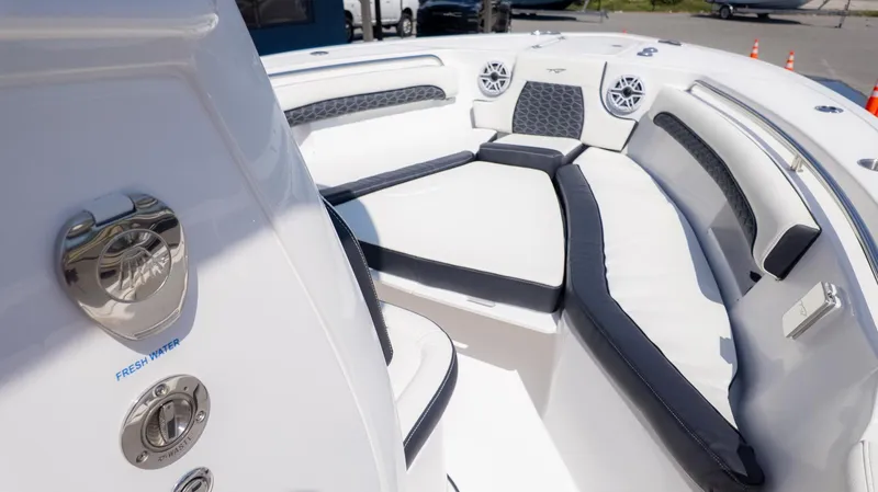 Slide: The Image of The image shows the bow of a Tidewater 232 LXF boat with cushioned seating. - 14