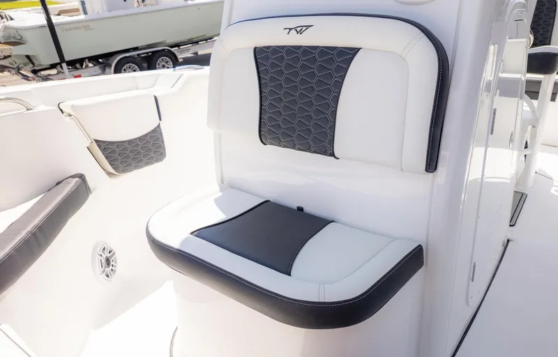Slide: The Image of A sleek seating area with white and black upholstery on a boat. - 19