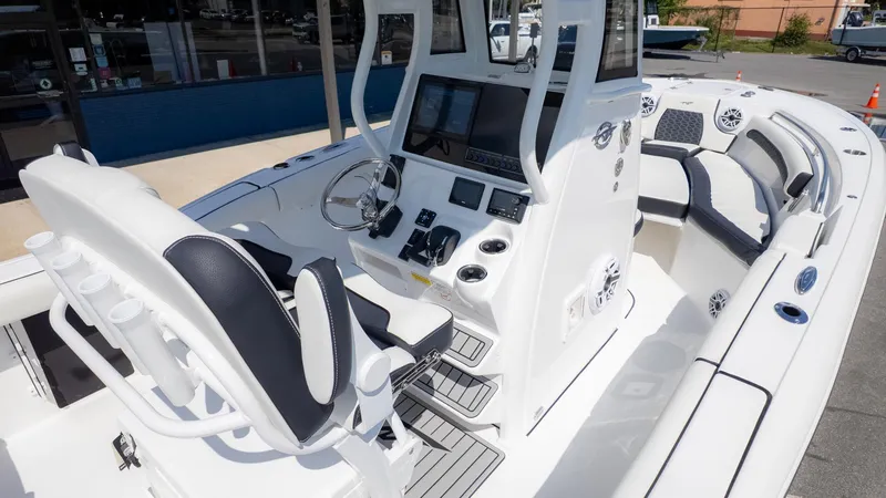 Slide: The Image of The image shows the cockpit of a 2026 Tidewater 232 LXF boat with modern instruments. - 7