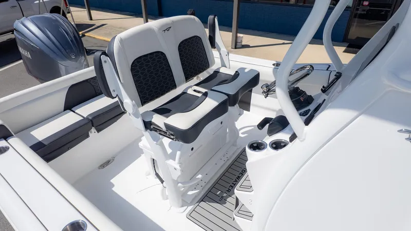 Slide: The Image of The image shows the cockpit of a Tidewater 232 LXF boat with modern seating and controls. - 8