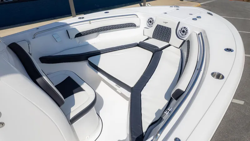 Slide: The Image of The image shows the bow area of a Tidewater 232 LXF boat with cushioned seating. - 9