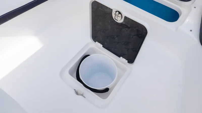 Slide: The Image of A white bucket in a built-in compartment on a boat. - 20