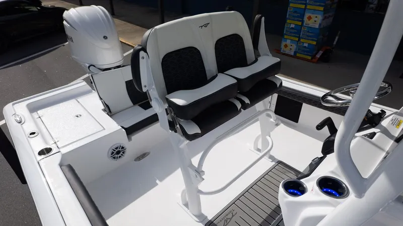 Slide: The Image of The image shows the cockpit of a Tidewater 2300 Carolina Bay boat with modern seating. - 15