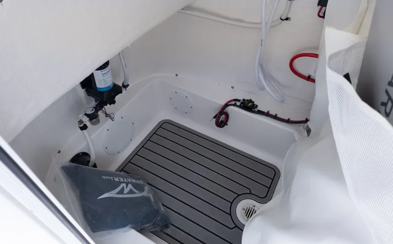 Slide: The Image of Interior of a boat with gray flooring and technical fittings. - 23