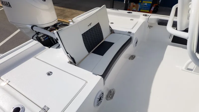 Slide: The Image of Rear view of a Tidewater 2300 Carolina Bay boat with Yamaha engine and cushioned seating. - 5