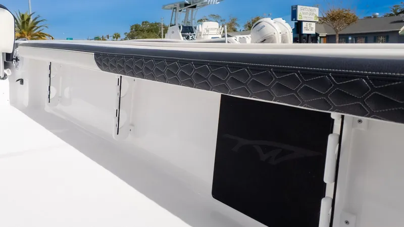 Slide: The Image of The image shows the interior of a Tidewater 2300 Carolina Bay boat with sleek detailing. - 4