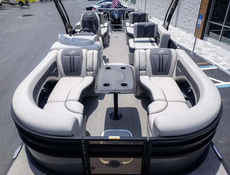 Slide: The Image of 2025 Barletta Corsa 23M with luxurious seating and a central table, parked on a lot. - 25
