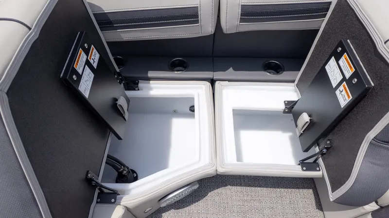 Slide: The Image of Interior view of a boat with two open storage compartments and cushioned seating. - 18