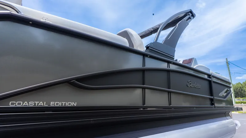 Slide: The Image of Side view of a Barletta Corsa 23M pontoon boat, Coastal Edition, featuring a sleek design. - 3