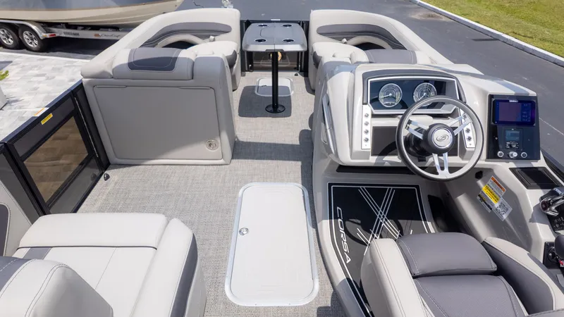 Slide: The Image of The image shows the cockpit of a 2025 Barletta Corsa 23M with modern instruments and comfortable seating. - 10