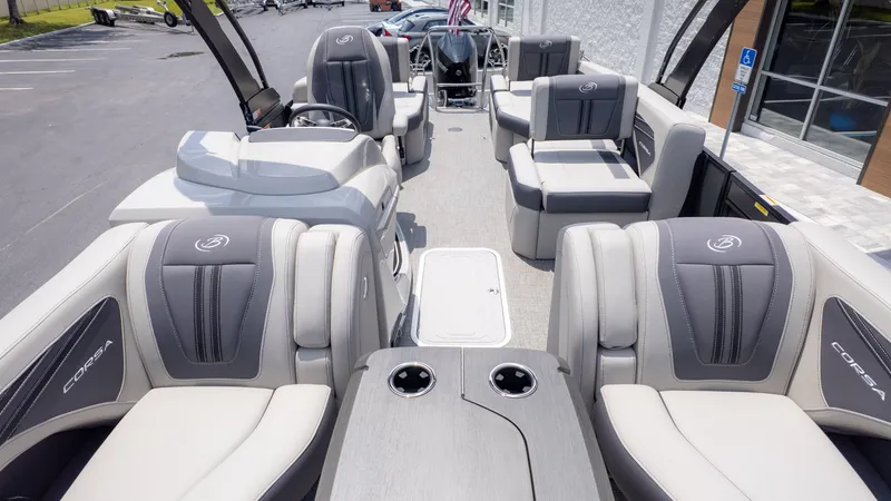 Slide: The Image of The image shows the interior of a Barletta Corsa 23M pontoon boat with luxurious seating. - 10