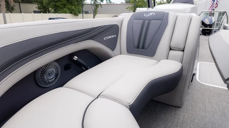 Slide: The Image of The image shows the luxurious interior of a Barletta Corsa 23M boat with sleek seating. - 25