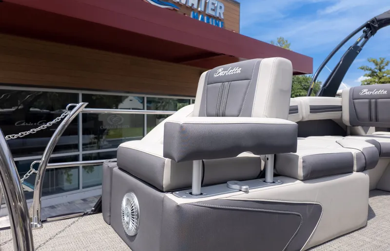 Slide: The Image of The image shows the deck of a Barletta Corsa 23M boat with sleek seating. - 7