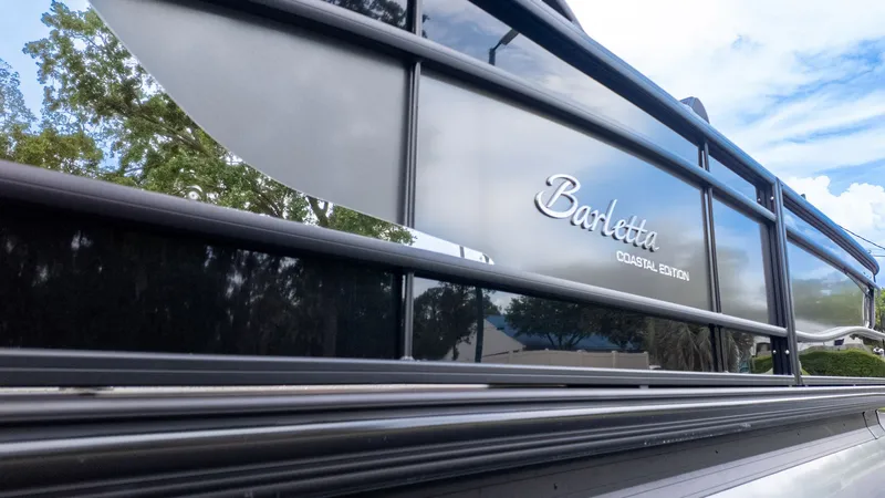 The Image of Close-up of Barletta LUSSO 25U with glossy black hull and silver lettering. - 1