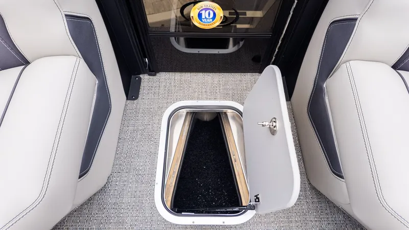 Slide: The Image of Interior of the Barletta LUSSO 25U with an open floor hatch between two seats. - 18