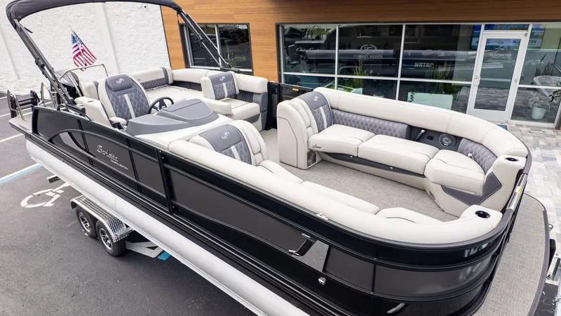 The Image of 2025 Barletta LUSSO 25U with luxurious seating and modern design, on a trailer. - 1