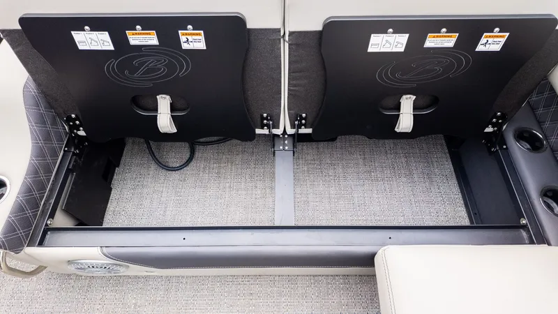 Slide: The Image of Rear view of two seats on a Barletta LUSSO 25U boat, with storage space underneath. - 9